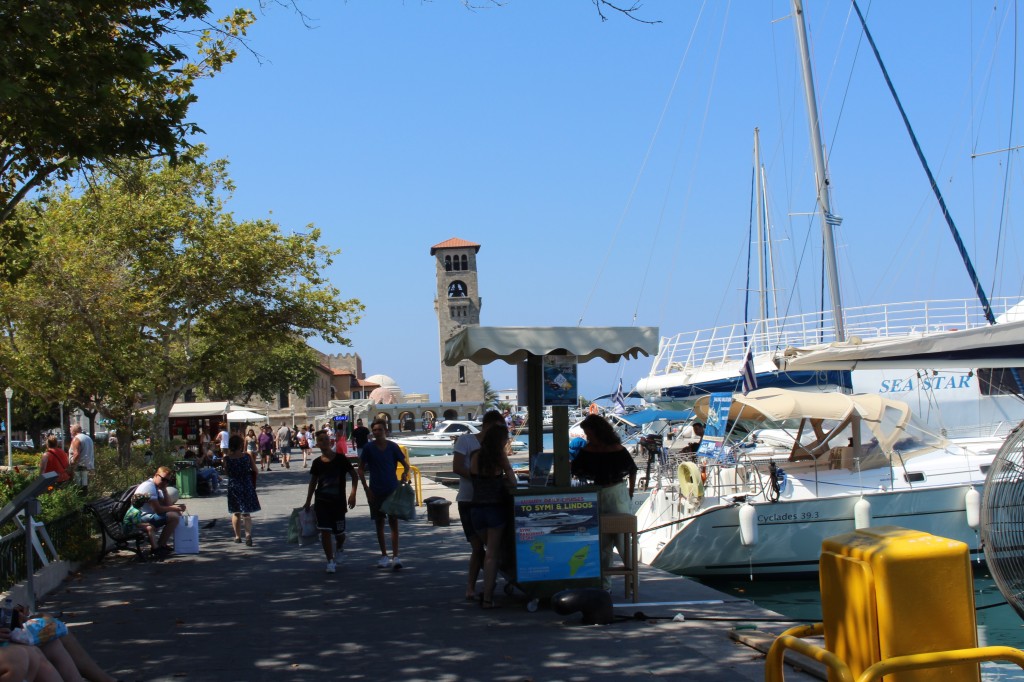 Stands offering tours at Mandraki Harbour in Rhodes.